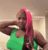a woman in a green tank top has pink hair and the name thatsmeatball