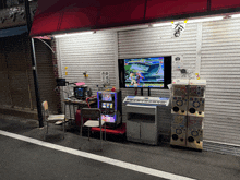 a video game is being played on a tv in front of a store