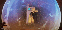 a picture of a snow globe with a disney logo on it
