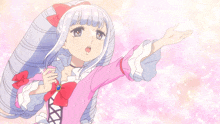 a girl in a pink dress with a bow on her hair