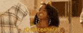 a woman with a bow in her hair is smiling and asking quinceanera