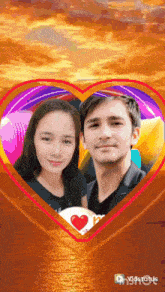 a picture of a man and a woman in a heart frame