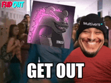 a man wearing a multiverse hat is holding a poster of a monster and says get out