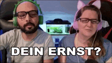 a man and a woman wearing cat ears and headphones with the words dein ernst behind them