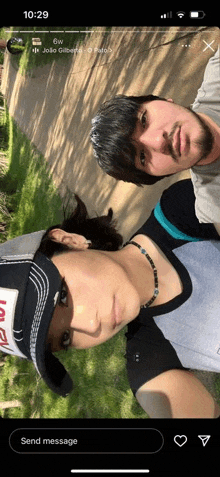 a man and a woman are posing for a picture with the time 10:29 on the bottom