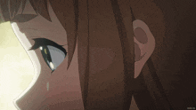 a close up of a girl 's face with an anime.tv logo