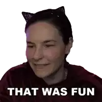 a woman wearing cat ears is smiling with the words that was fun written below her