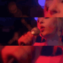 a close up of a woman 's face with lights behind her