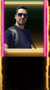 a man wearing sunglasses and a backpack is standing in a neon frame