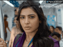 a picture of a woman on a train with the words startami chat in the bottom right corner