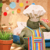 a stuffed animal with a chef 's hat and apron