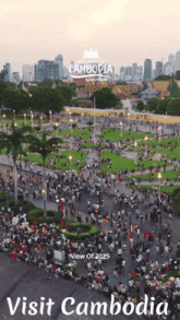 an advertisement for visit cambodia shows a large crowd of people in a park