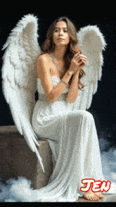 a woman in a white angel costume is sitting on a stone