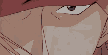 a close up of a person 's face with a red mask on