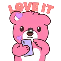 a pink teddy bear is holding a cell phone and the words love it are above it
