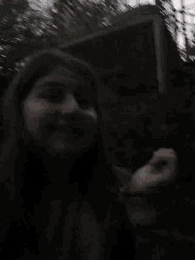a close up of a person 's face in the dark .