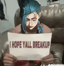 a girl with blue hair is holding a sign that says i hope yall breakup