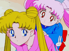 a girl in a pink shirt with a bunny on it is standing next to a girl in a blue shirt