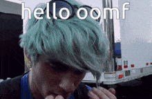 a man with green hair says hello oomf