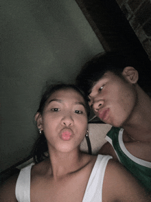 a man and a woman making funny faces with their lips