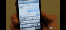 a person is holding a cell phone with a message from craig on it