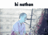 a man singing into a microphone with the words hi nathan written above him
