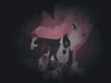 a person is laying on their back on a red surface in a dark room .