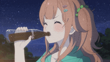 a girl is drinking a bottle of coca-cola