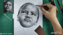 a person is drawing a child 's face with a pencil