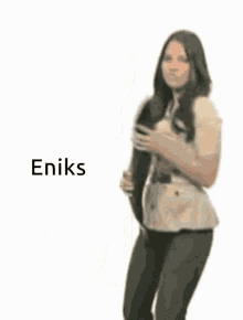 a woman is holding a large fish in her hands with the word eniks above her