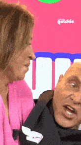 a man and a woman are looking at each other in front of a sign that says ' madrid quickie '