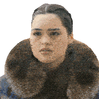 a woman wearing a fur collar and earrings looks serious