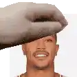 a close up of a man 's face with a hand holding his head .