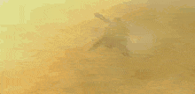 a robot with a gun is flying through the air in a video game .