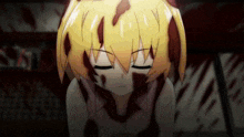 a girl with blood on her face is laying on the ground
