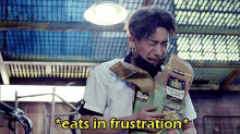 a man is crying while holding a bag of tortilla chips .