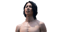 a shirtless man with long black hair reaches out his hand