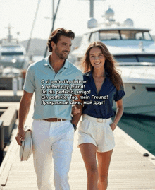 a man and a woman are walking on a dock with a poem in a foreign language