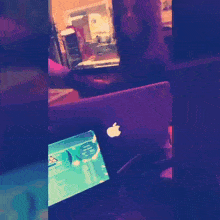 a collage of images shows flowers falling from a tree and an apple laptop