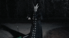 a person with a mask on their face is holding a stick in their hand .