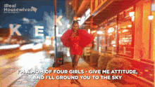 a poster for the real housewives shows a woman in a red dress walking down a street