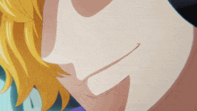 a close up of a person 's face with a smile