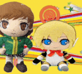 two stuffed dolls are standing next to each other on a colorful background