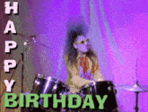 a woman playing drums with the words happy birthday behind her