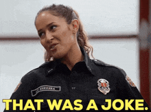 a woman in a fireman 's uniform says that was a joke