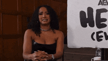 a woman says i support britain in front of a sign that says he