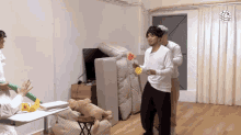 a group of people playing a game in a room