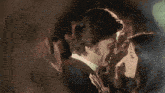 a man and a woman are looking at each other