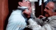 two men are fighting each other and one of them is saying no !