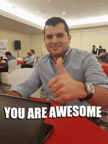 a man giving a thumbs up with the words you are awesome written below him